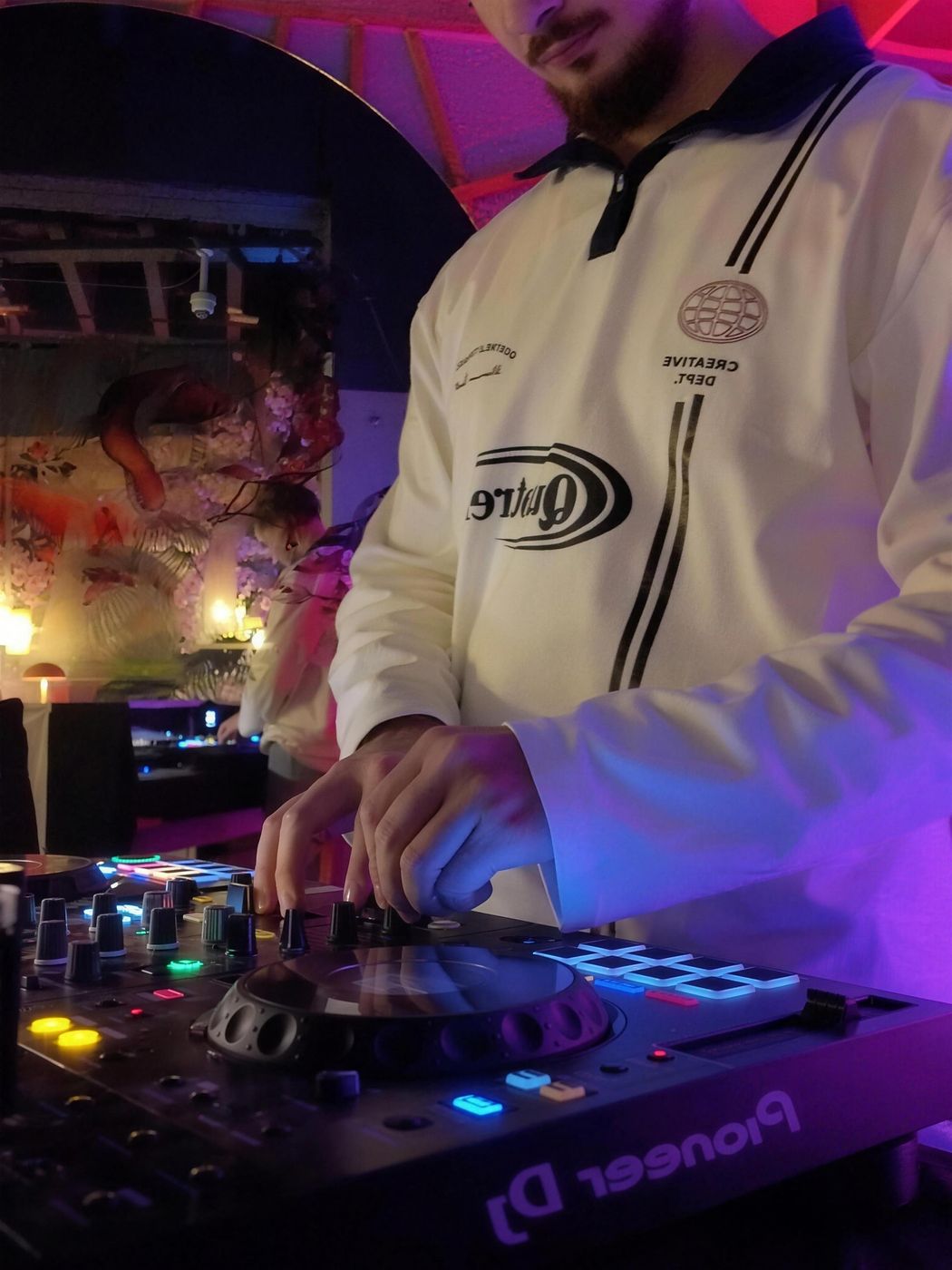 SEYMEN on Pioneer decks in a white jacket